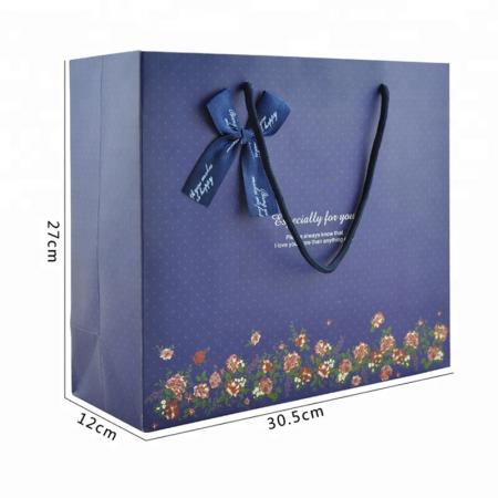 impresión de logotipo personalizado laminado de color azul brillante bolsas de papel de regalo de compras