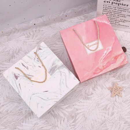 logotipo personalizado impreso lujo rosa oro papel compras llevar bolsa de embalaje de regalo con asas de cuerda para tienda