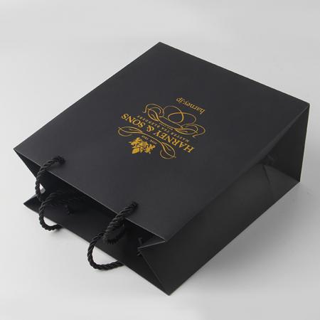 Bolsas de papel de compras de marca de lujo de diseño personalizado con logotipos