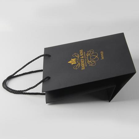 Bolsas de papel de compras de marca de lujo de diseño personalizado con logotipos
