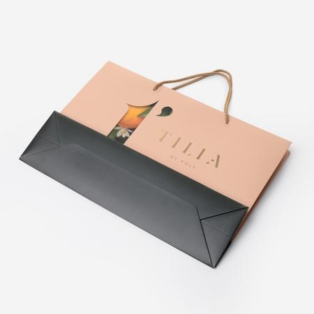 Luxury cosmetics gift shopping paper bags with button customized