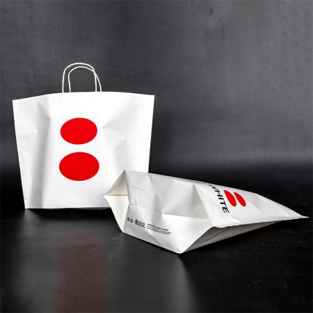 Bolsa de papel kraft blanca exquisita personalizada de diseño al por mayor con su logotipo