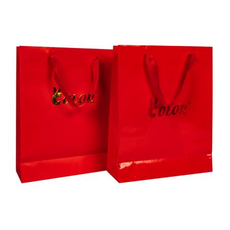 Bolsas de regalo de papel de diseño geométrico de alta calidad más vendidas con asas de papel planas hechas a mano personalizadas